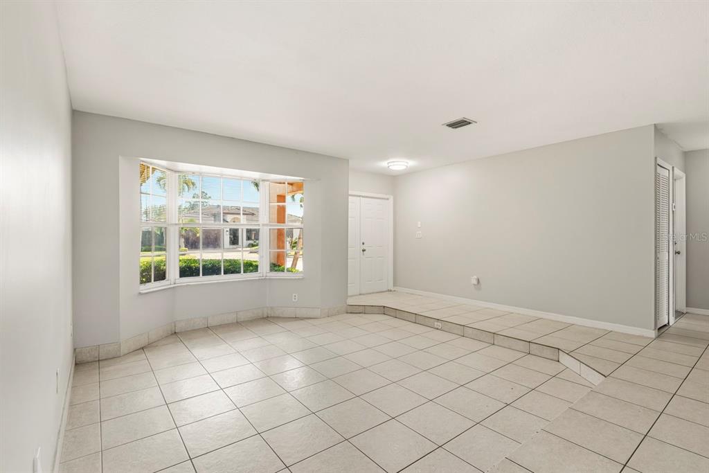 15313 Southwest 138th Terrace Miami, FL 33196 - Photo 16 of 44 an empty room with windows