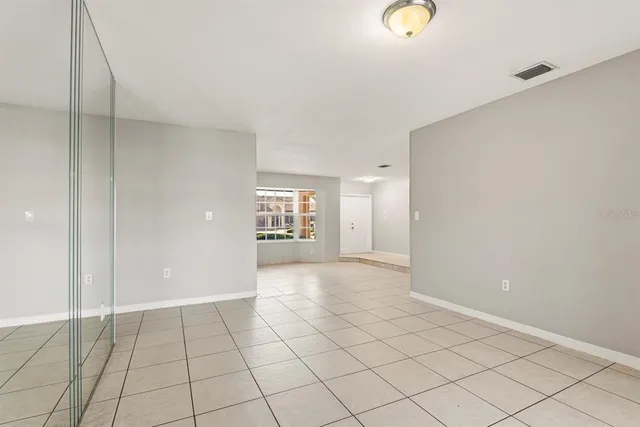 a view of an empty room and window