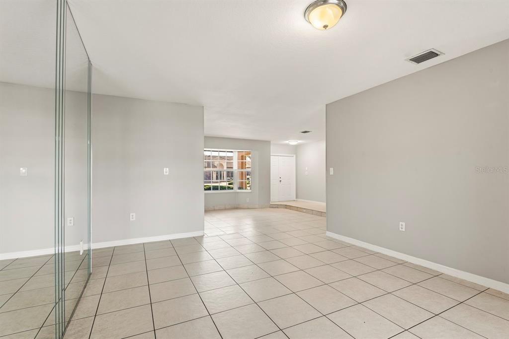 15313 Southwest 138th Terrace Miami, FL 33196 - Photo 18 of 44 a view of an empty room and window