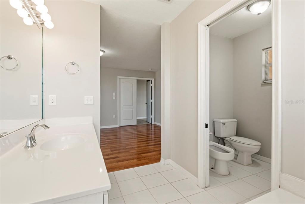 15313 Southwest 138th Terrace Miami, FL 33196 - Photo 24 of 44 a bathroom with a sink a toilet and shower