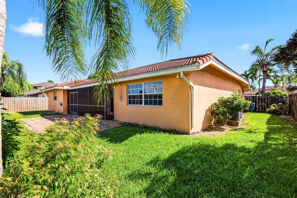 15313 Southwest 138th Terrace Miami, FL 33196 - Photo 43 of 44 a view of a house with a yard