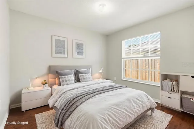 a bedroom with a bed and a couch