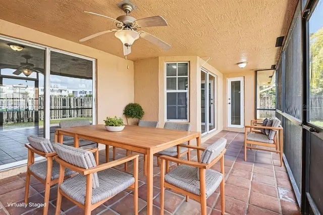 a view of a dining room with furniture large windows and wooden floor