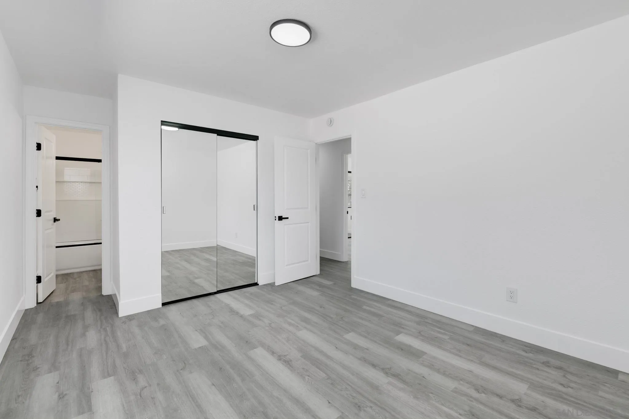 9125 Akard Street Spring Valley, CA 91977 - Photo 15 of 25 a view of an empty room and wooden floor