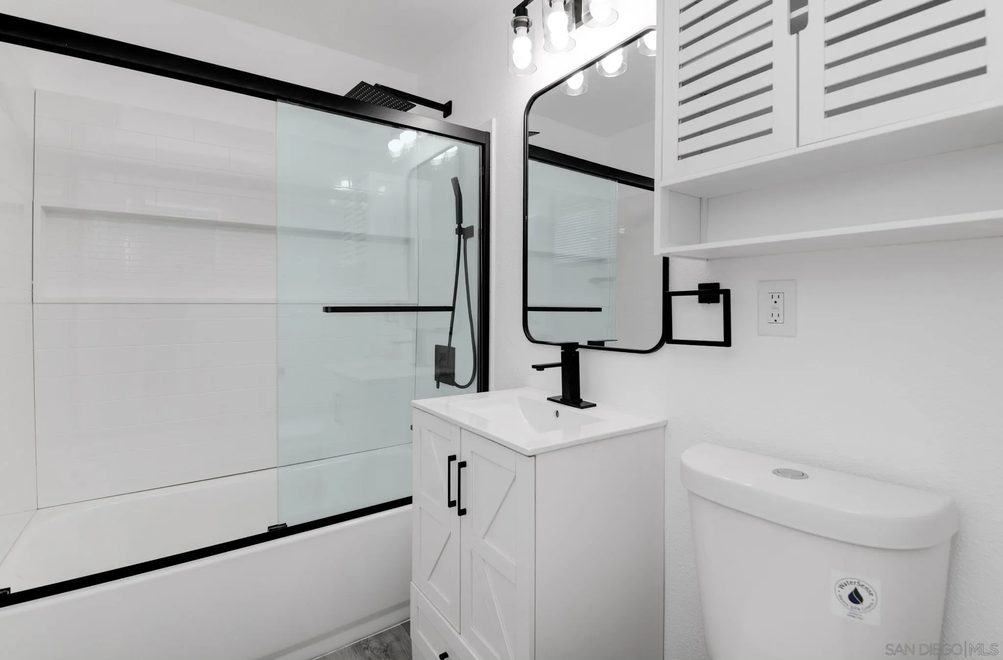 9125 Akard Street Spring Valley, CA 91977 - Photo 16 of 25 a bathroom with a shower and a sink a mirror
