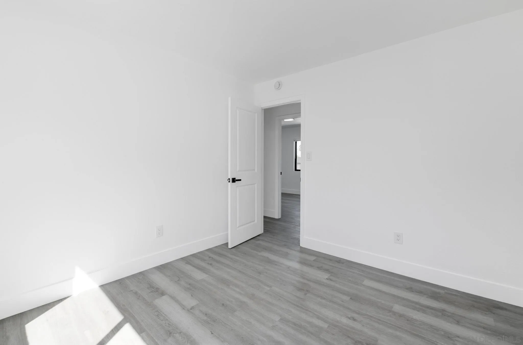 9125 Akard Street Spring Valley, CA 91977 - Photo 18 of 25 a view of an empty room with wooden floor