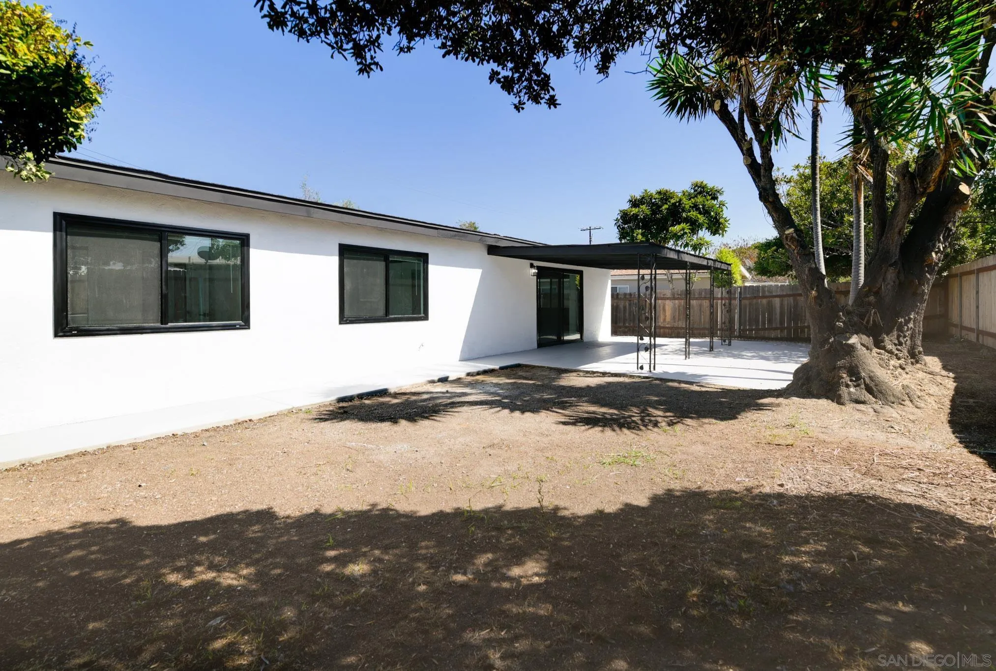 9125 Akard Street Spring Valley, CA 91977 - Photo 24 of 25 a view of a house with a yard covered in snow