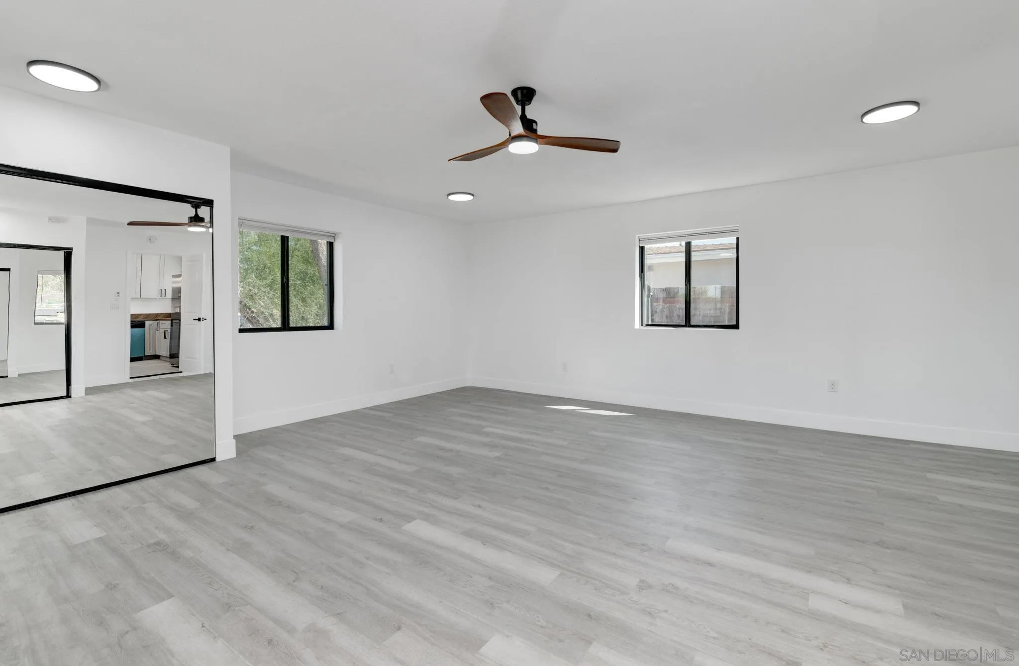 9125 Akard Street Spring Valley, CA 91977 - Photo 8 of 25 a view of an empty room with window and wooden floor