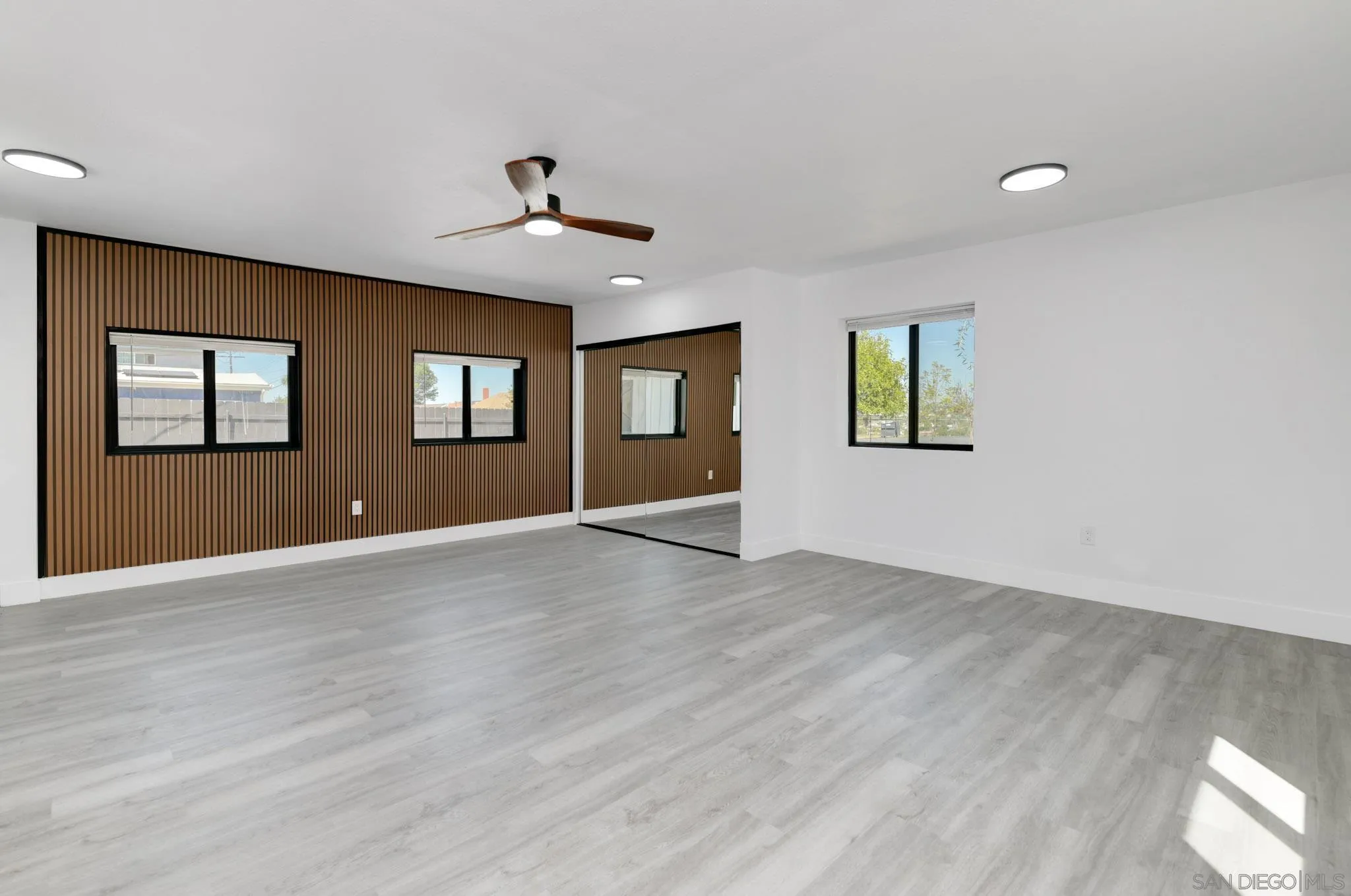 9125 Akard Street Spring Valley, CA 91977 - Photo 10 of 25 a view of an empty room with window and wooden floor