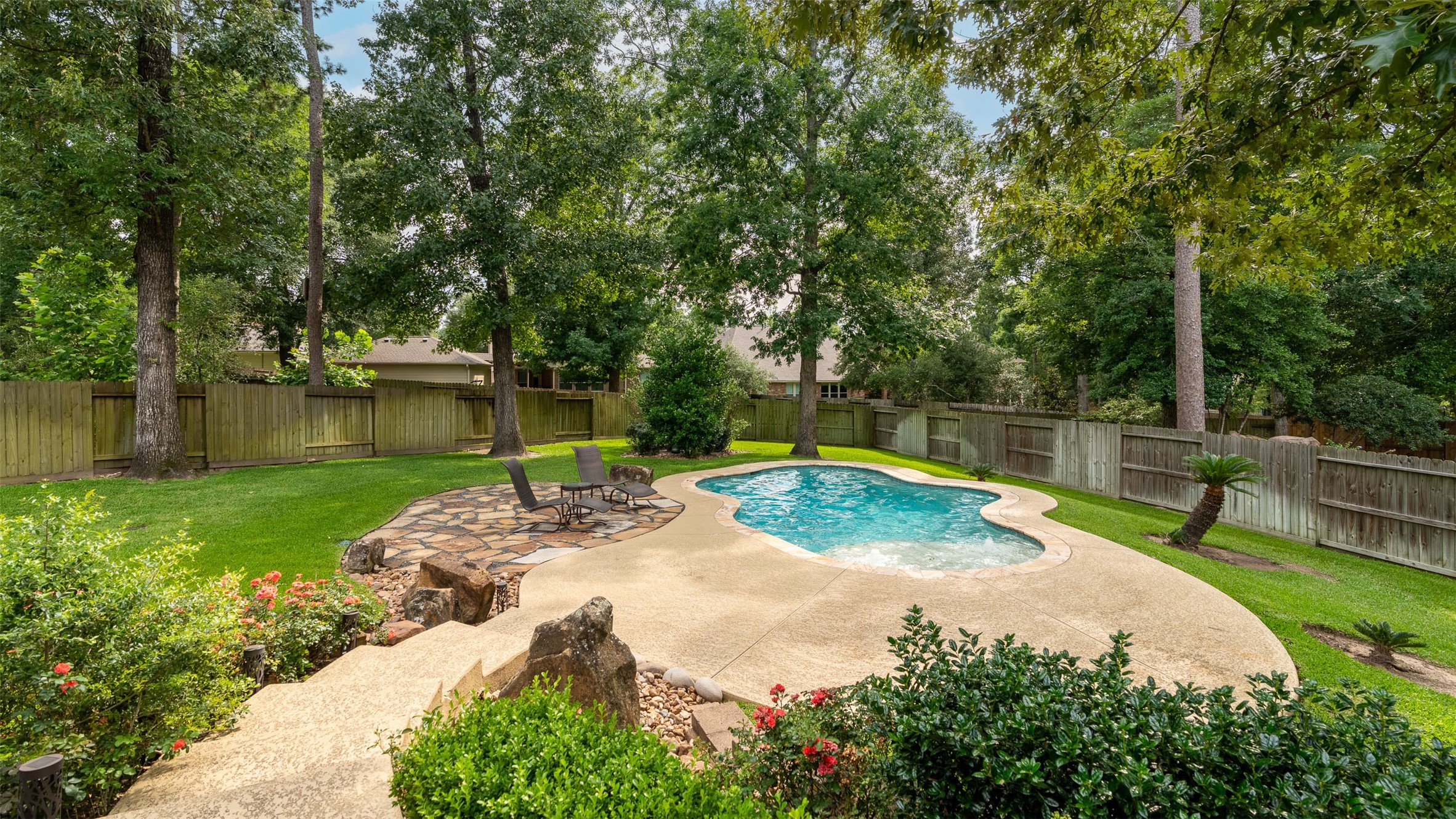 2115 Graystone Ridge Drive Conroe, TX 77304 - Photo 42 of 47 Enjoy your outdoor oasis featuring a beautiful, refreshing pool—an ideal retreat for relaxing, entertaining, and soaking up the outdoors in comfort and style
