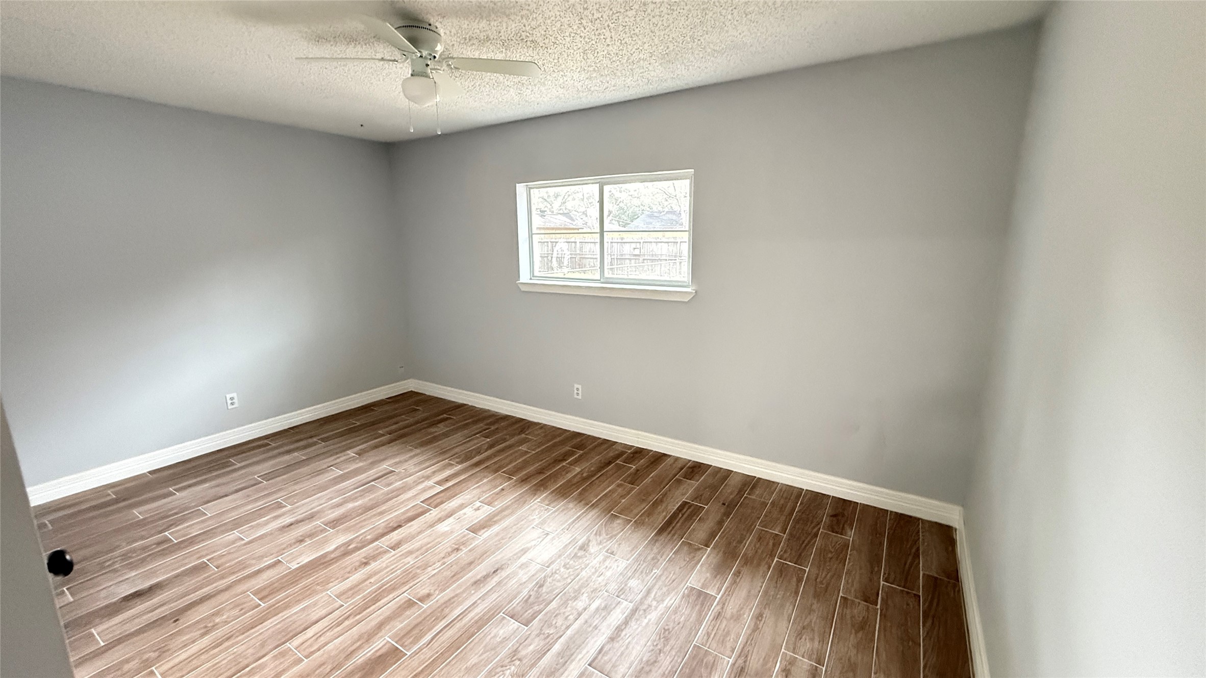 4202 Junker Street Rosenberg, TX 77471 - Photo 13 of 20 an empty room with a window