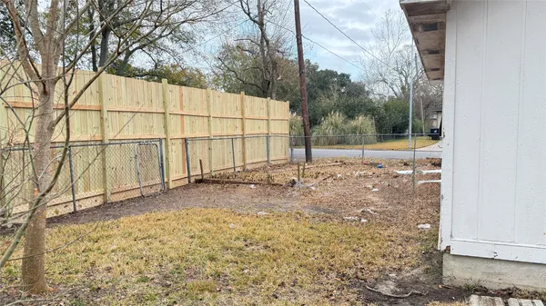 a view of a backyard of the house