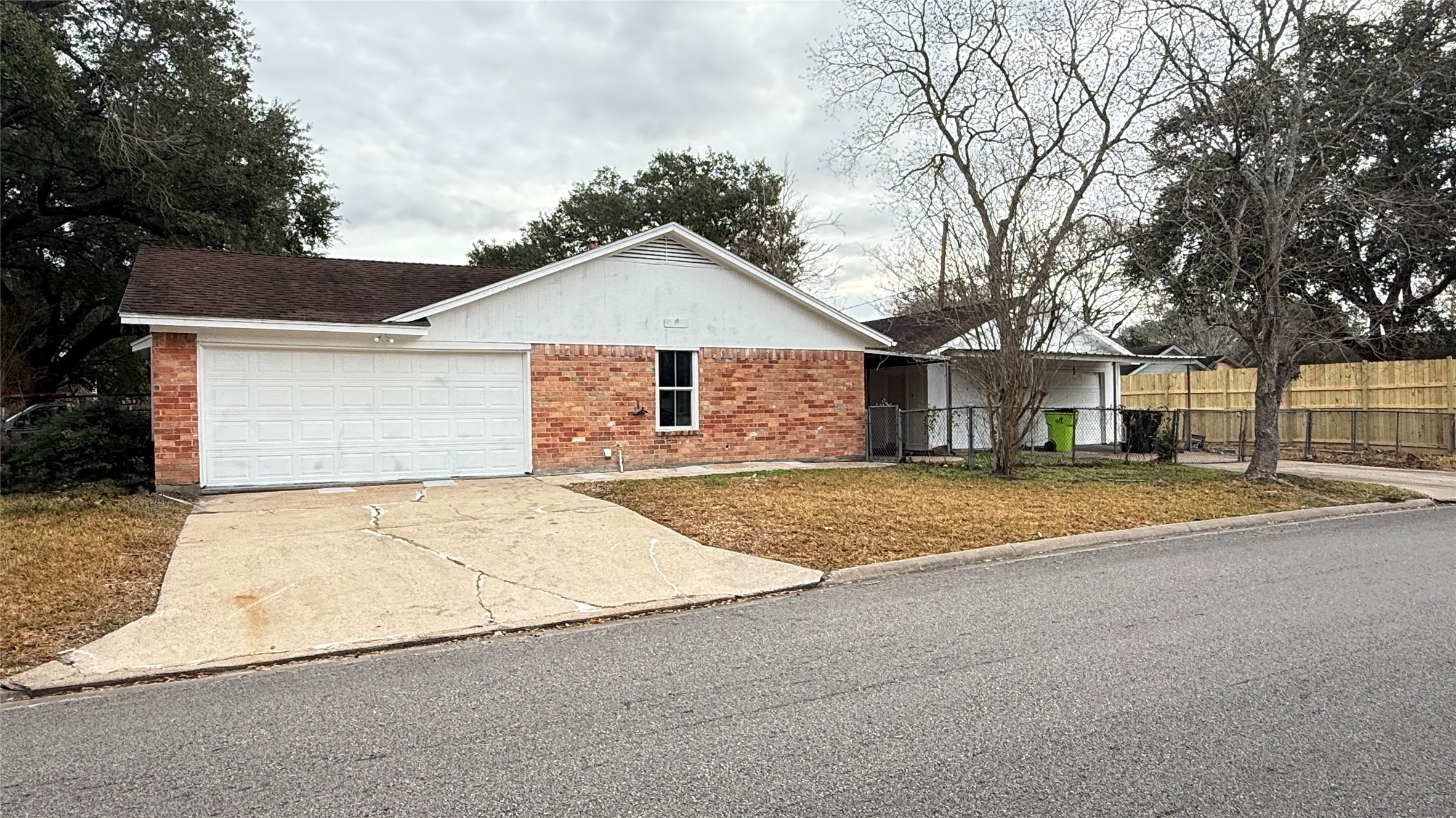 4202 Junker Street Rosenberg, TX 77471 - Photo 3 of 20 a front view of a house with a yard and garage
