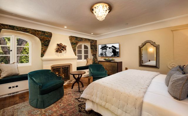 a bedroom with a bed and a couch