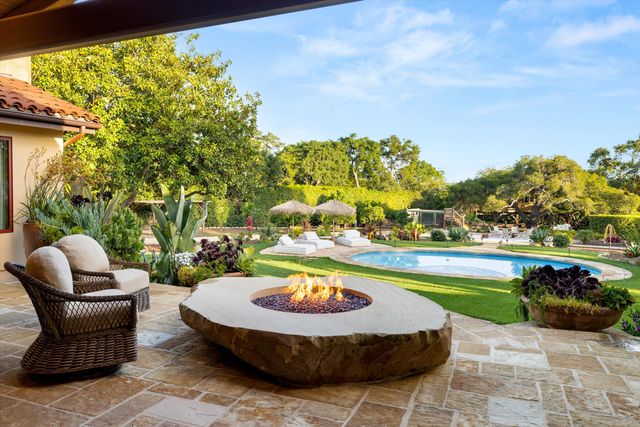 a view of a swimming pool with a patio