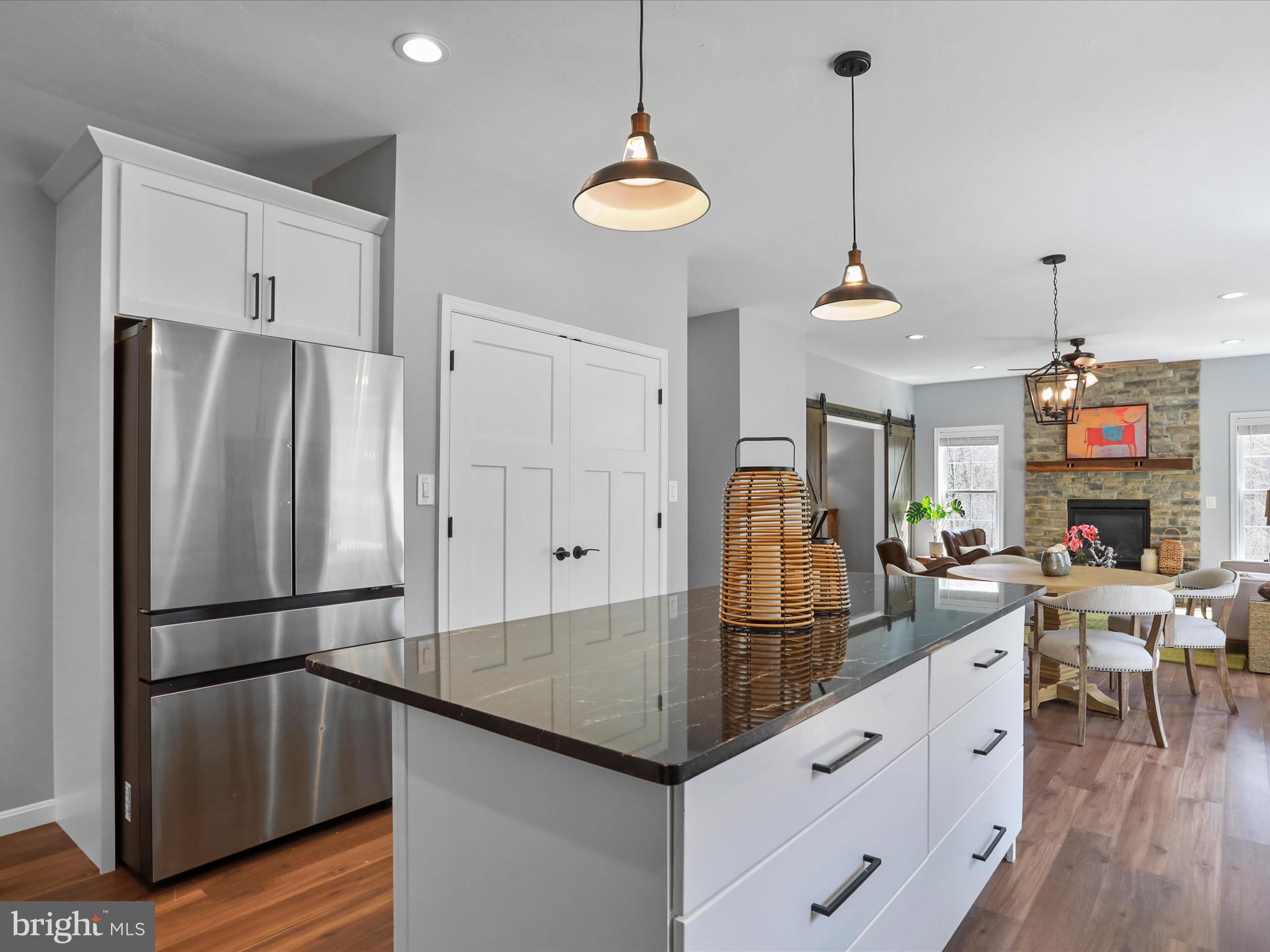 19 Spring Trail Fairfield, PA 17320 - Photo 24 of 71 a kitchen with stainless steel appliances granite countertop a refrigerator a sink and a chandelier