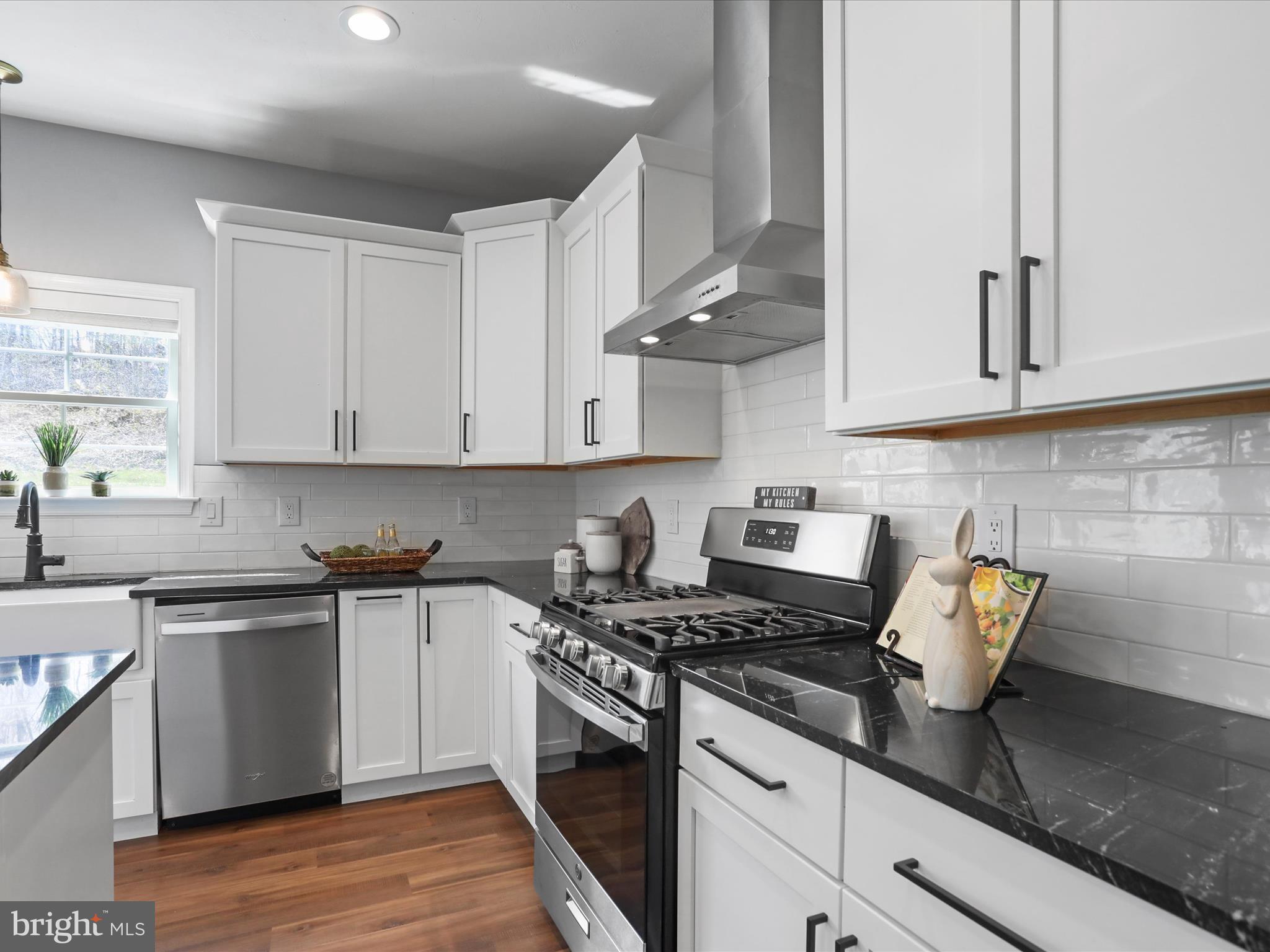 19 Spring Trail Fairfield, PA 17320 - Photo 27 of 71 a kitchen with stainless steel appliances granite countertop a sink stove and cabinets
