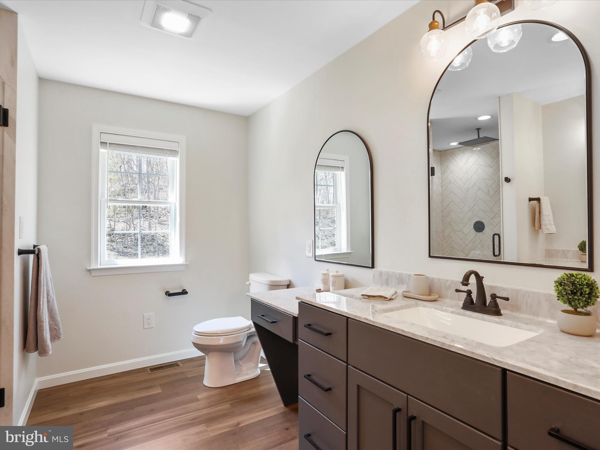 19 Spring Trail Fairfield, PA 17320 - Photo 43 of 71 a bathroom with a double vanity sink and a mirror