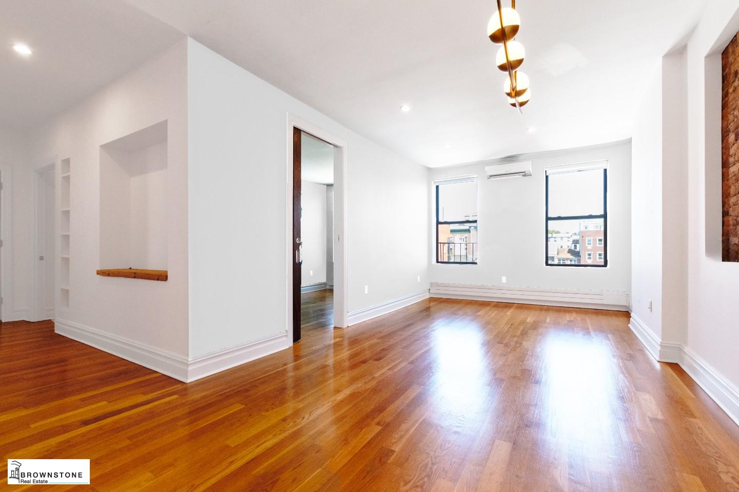 203 Luquer Street, Unit 4B Brooklyn, NY 11231 - Photo 2 of 6 a view of an empty room with window and wooden floor