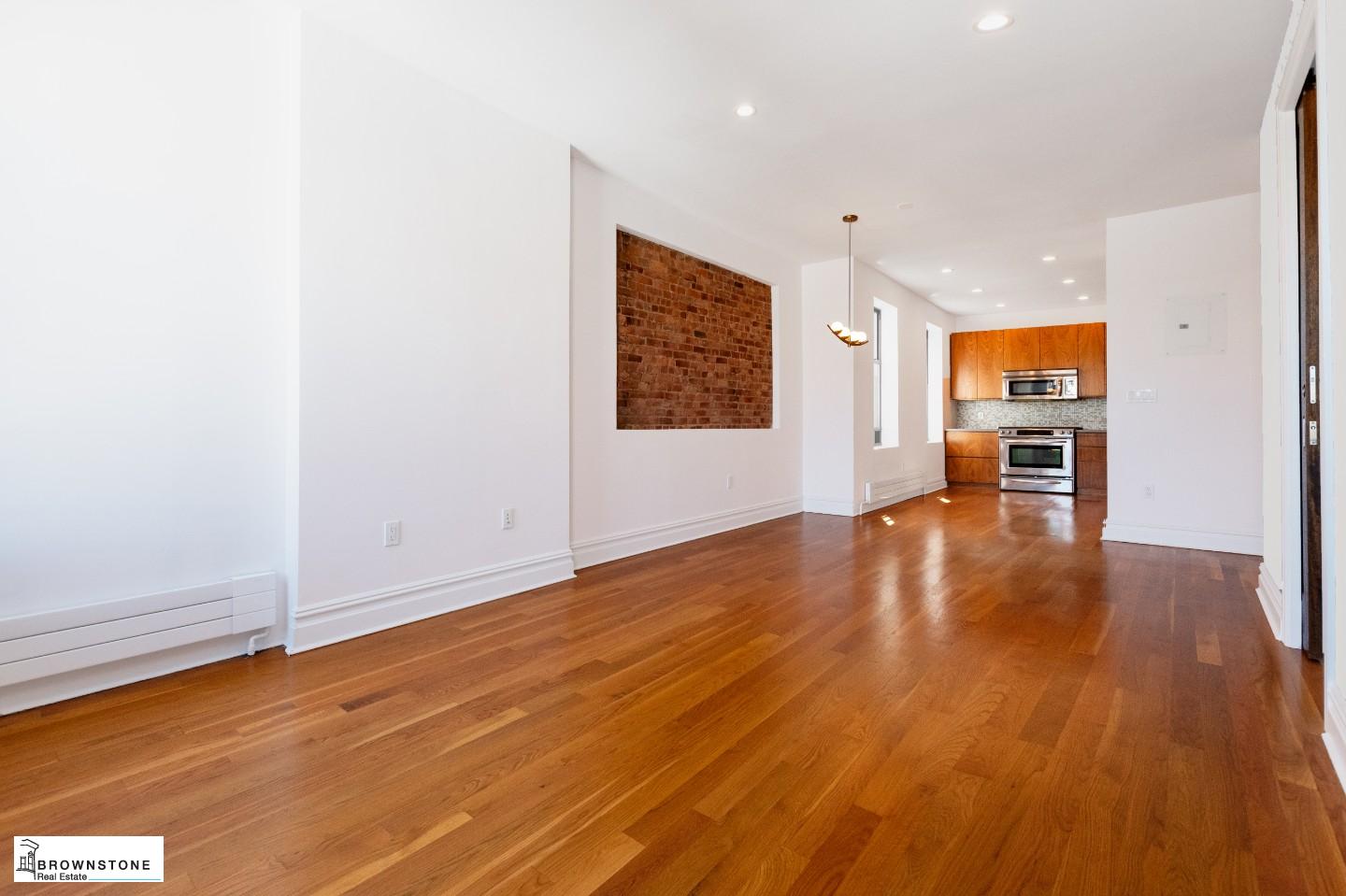 203 Luquer Street, Unit 4B Brooklyn, NY 11231 - Photo 3 of 6 wooden floor in an empty room with a window