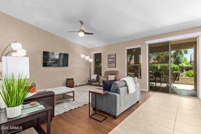 a living room with furniture and a large window