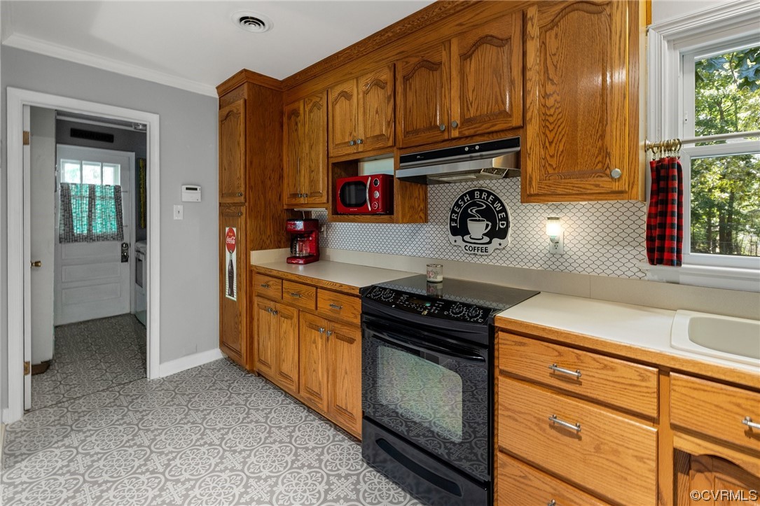9505 Beach Road Chesterfield, VA 23838 - Photo 13 of 32 a kitchen with stainless steel appliances granite countertop a stove and a refrigerator