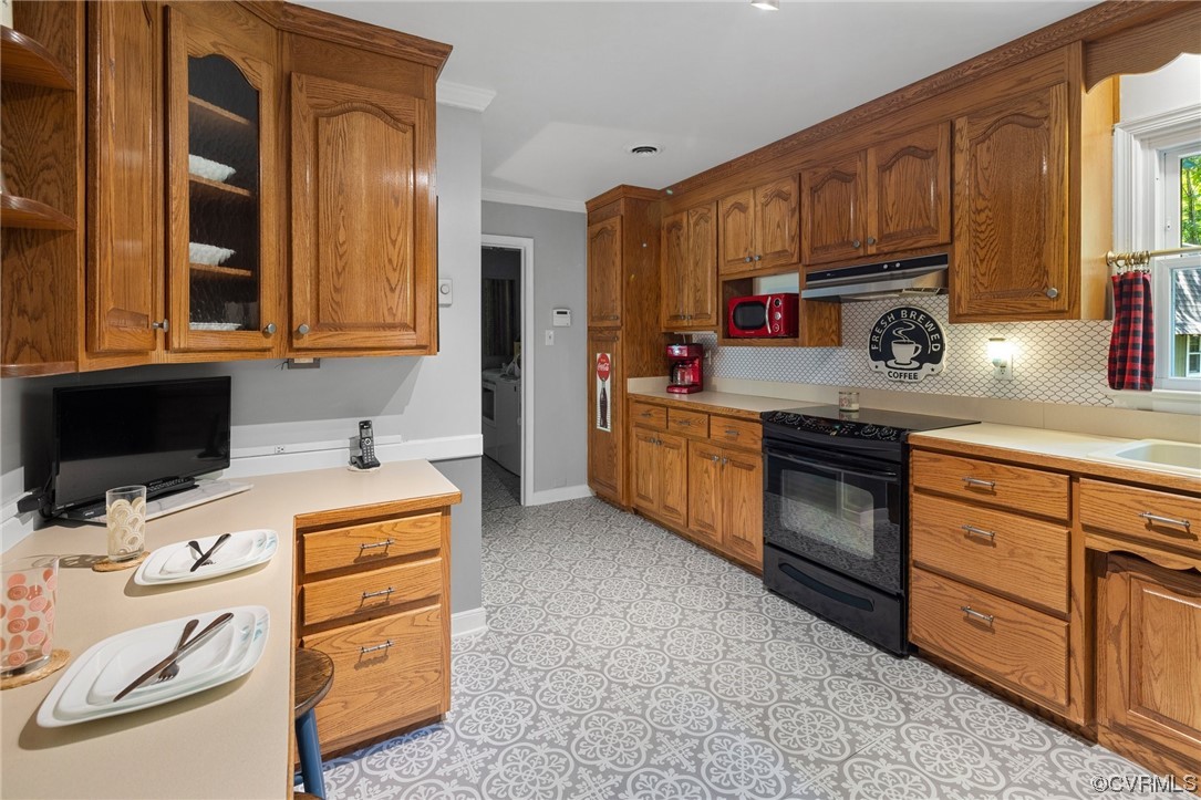 9505 Beach Road Chesterfield, VA 23838 - Photo 14 of 32 a kitchen with stainless steel appliances a stove a sink and a microwave