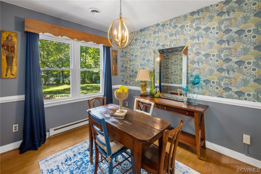 9505 Beach Road Chesterfield, VA 23838 - Photo 15 of 32 a view of a dining room with furniture window and wooden floor