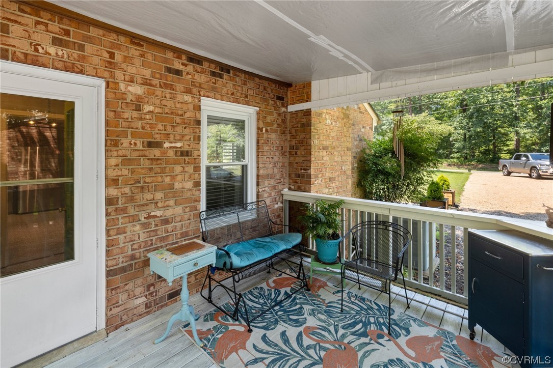 9505 Beach Road Chesterfield, VA 23838 - Photo 23 of 32 a balcony with furniture and wooden floor