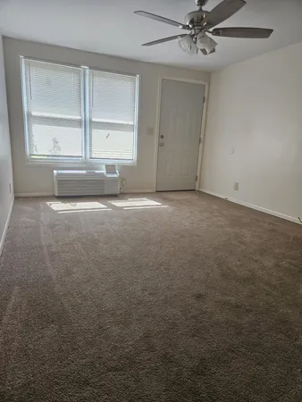 a view of an empty room with a window