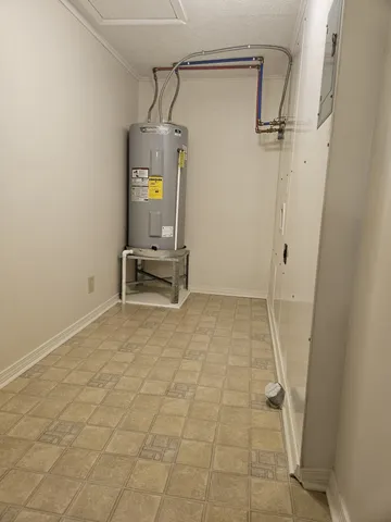 a view of storage and utility room with closet area