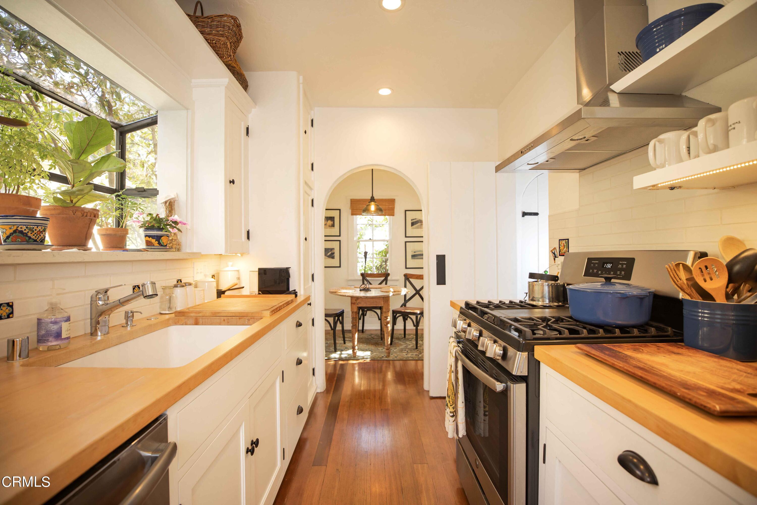 426 South Berkeley Avenue Pasadena, CA 91107 - Photo 12 of 32 a kitchen that has a lot of cabinets in it