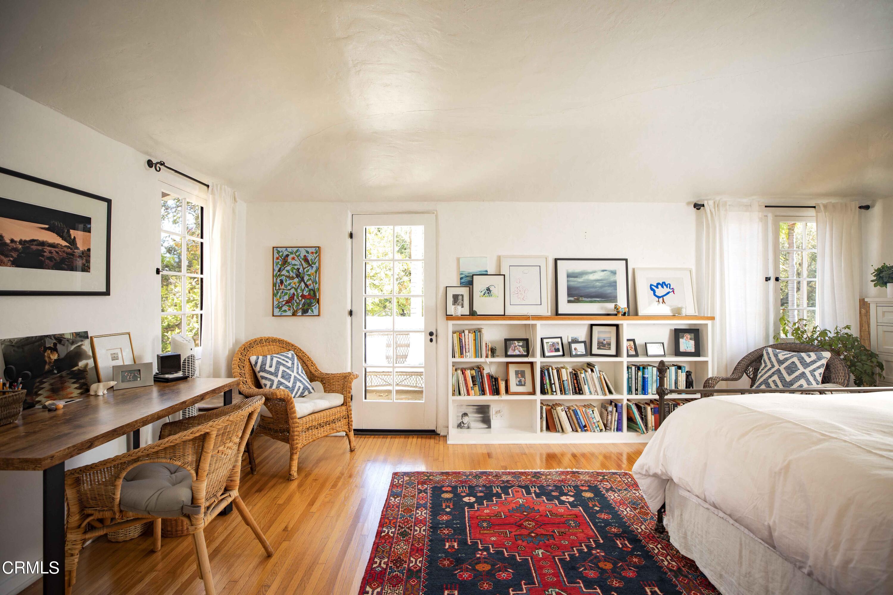 426 South Berkeley Avenue Pasadena, CA 91107 - Photo 16 of 32 a bed room with a bed and a book shelf