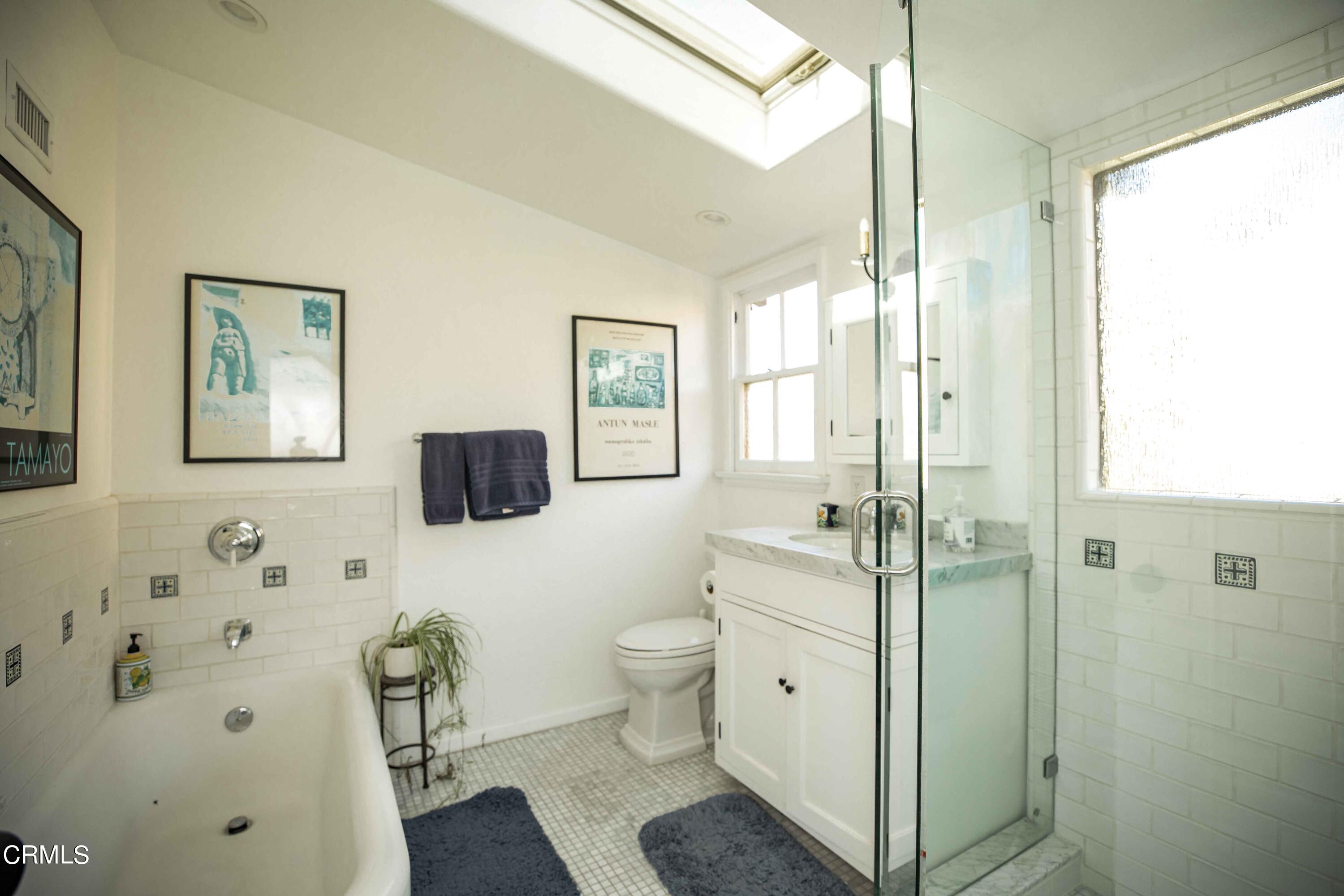426 South Berkeley Avenue Pasadena, CA 91107 - Photo 18 of 32 a bathroom with a toilet sink and a mirror