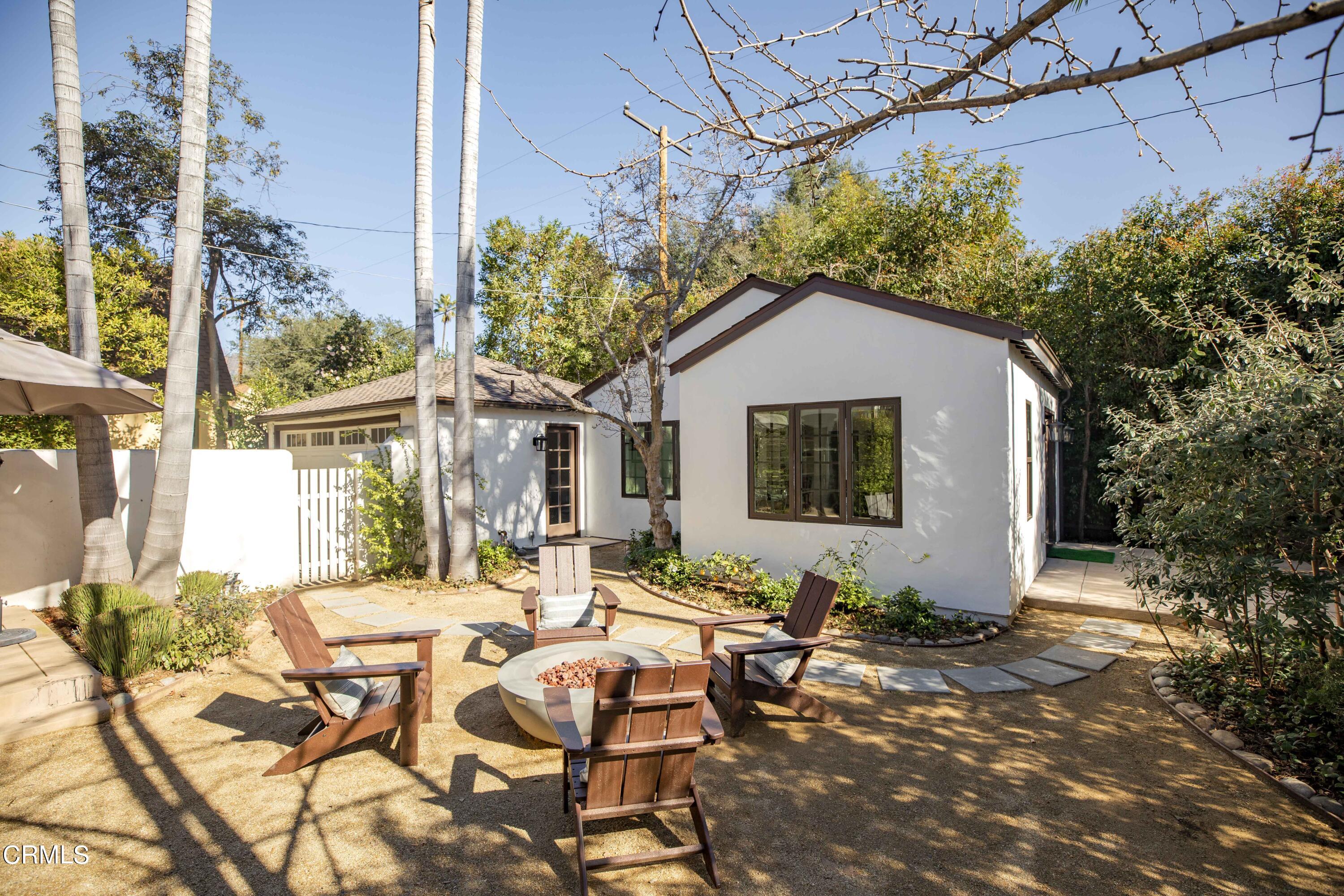 426 South Berkeley Avenue Pasadena, CA 91107 - Photo 22 of 32 a backyard of a house with table and chairs