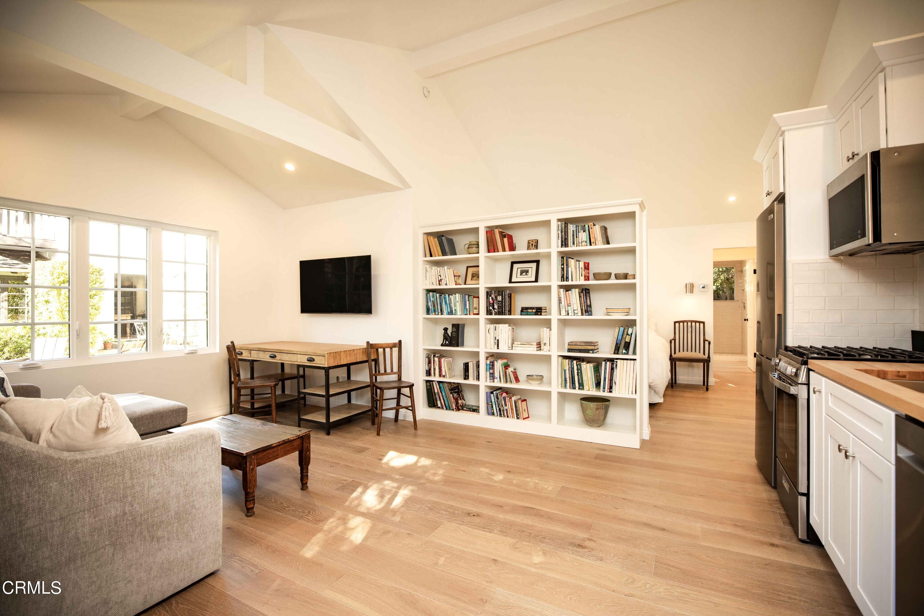 426 South Berkeley Avenue Pasadena, CA 91107 - Photo 24 of 32 a living room with furniture and a flat screen tv