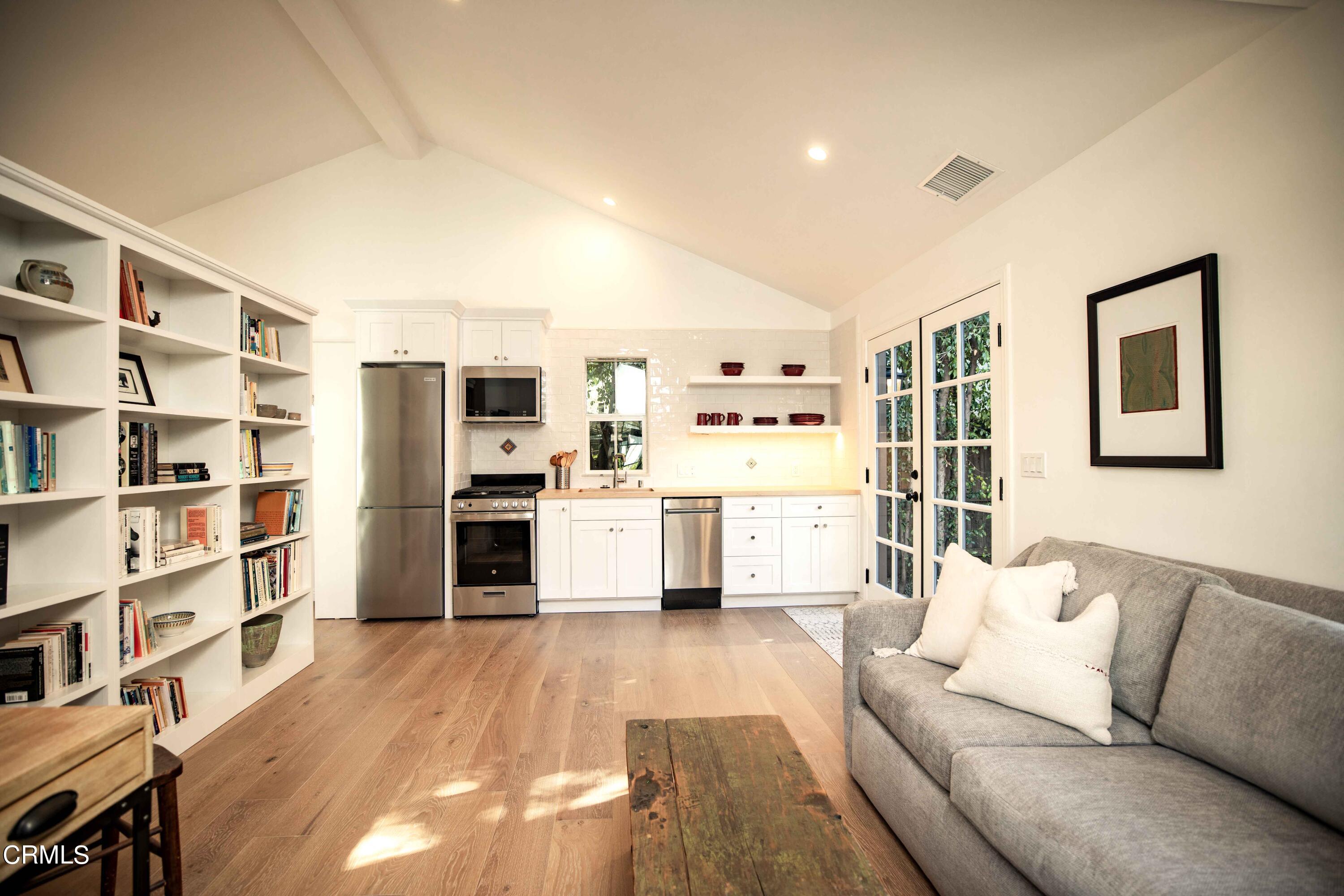 426 South Berkeley Avenue Pasadena, CA 91107 - Photo 25 of 32 a living room with furniture cabinets and a flat screen tv