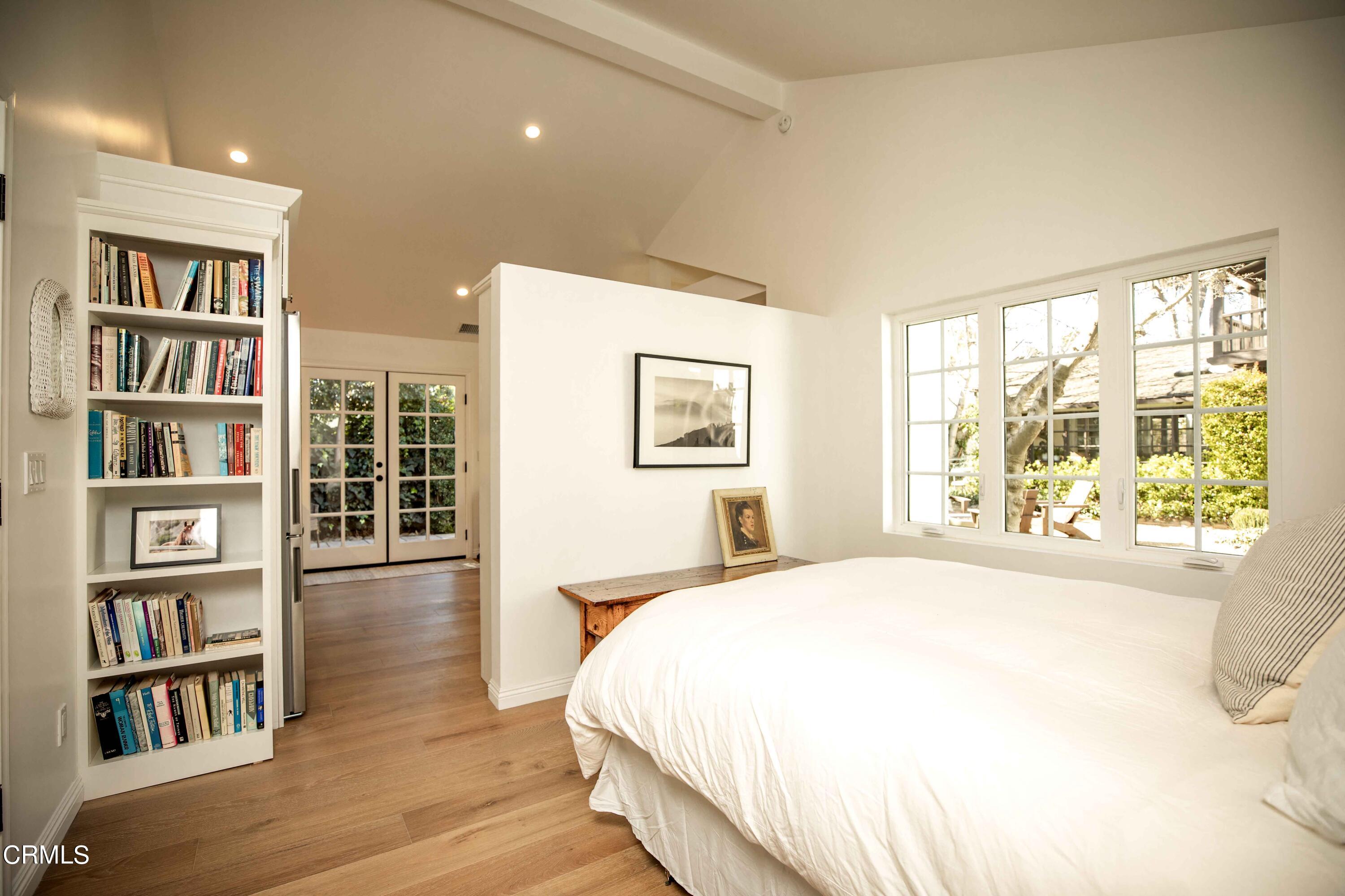 426 South Berkeley Avenue Pasadena, CA 91107 - Photo 28 of 32 a spacious bedroom with a bed and a large window