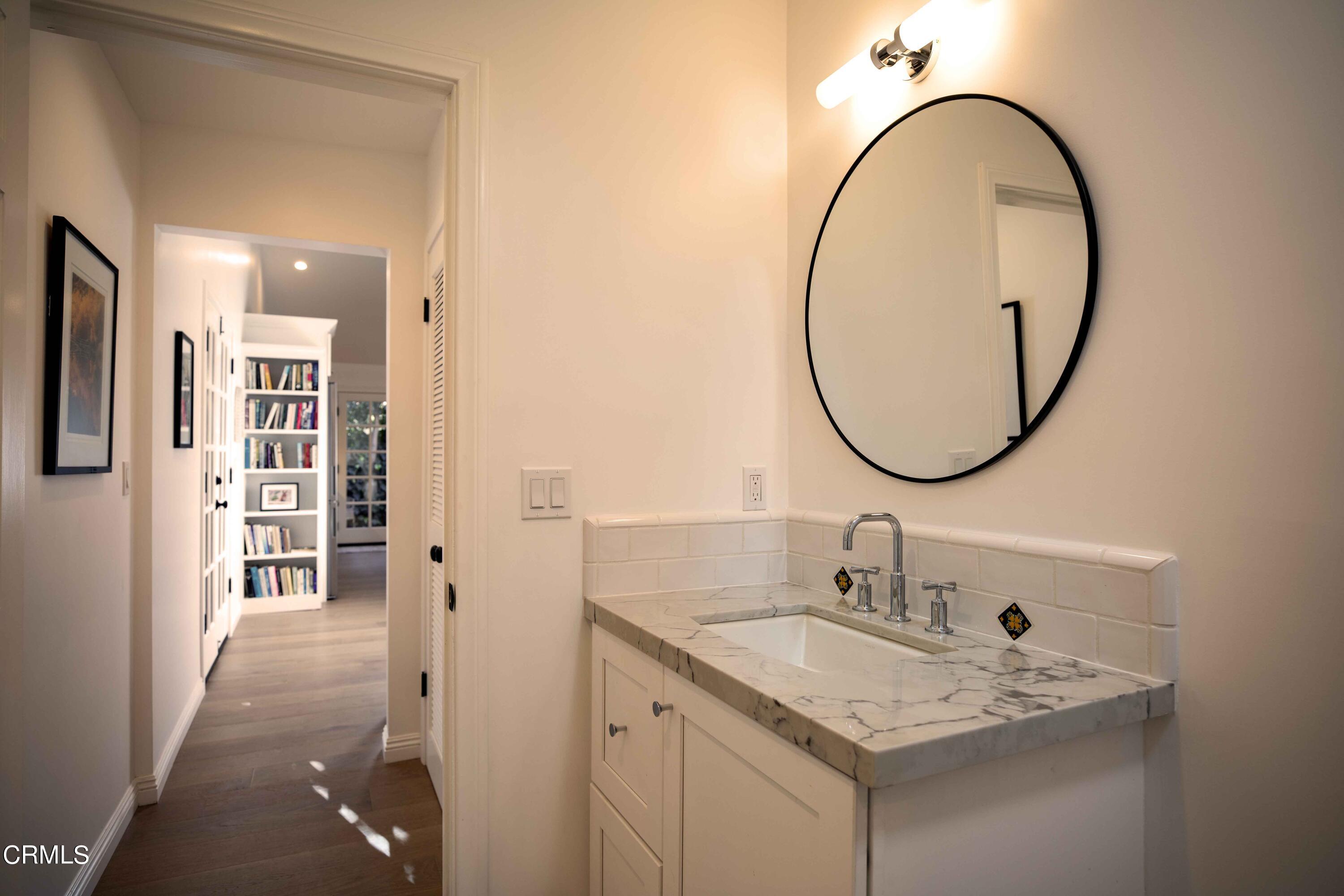 426 South Berkeley Avenue Pasadena, CA 91107 - Photo 29 of 32 a bathroom with a sink and a mirror