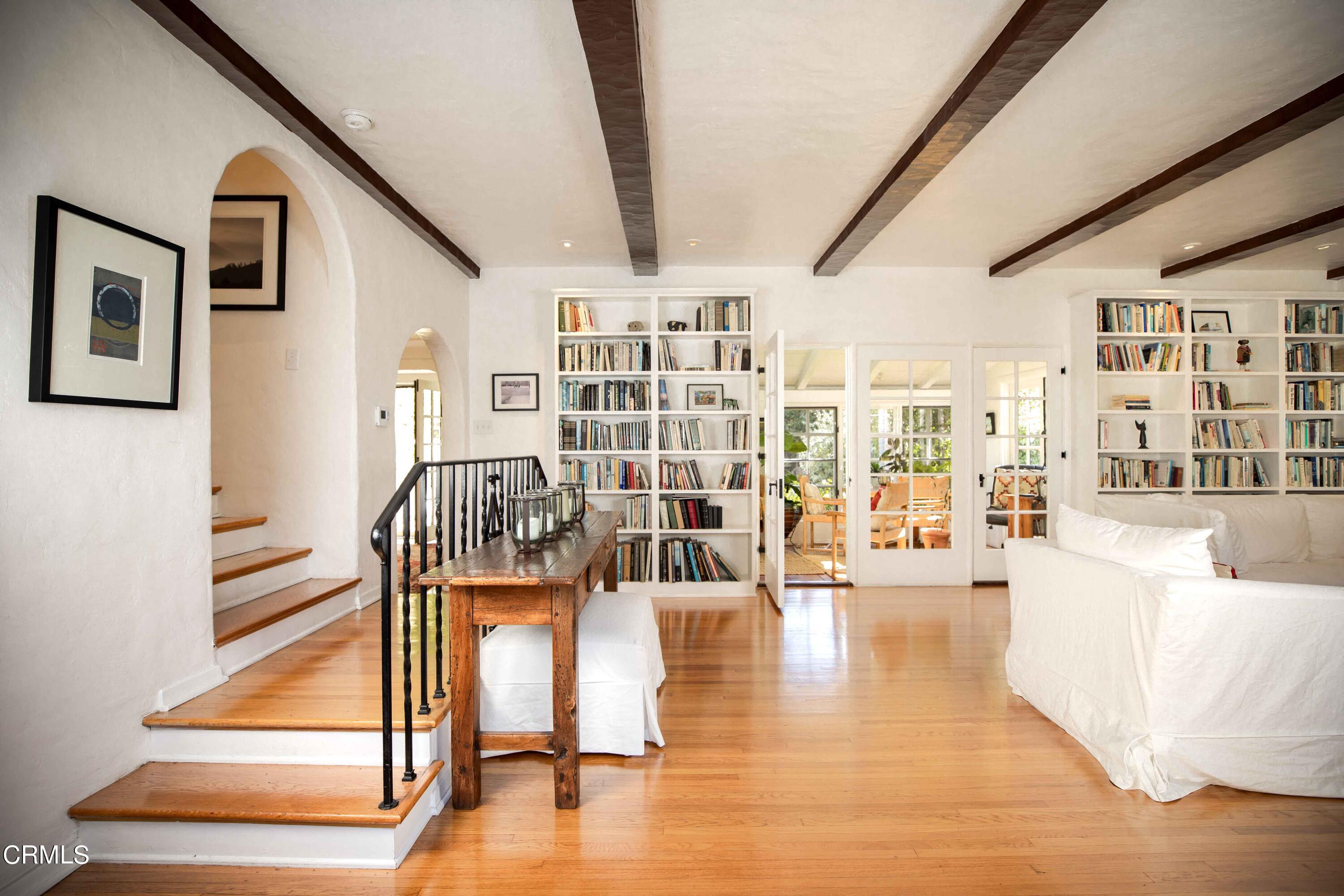 426 South Berkeley Avenue Pasadena, CA 91107 - Photo 5 of 32 a living room with couches and pool view with wooden floor