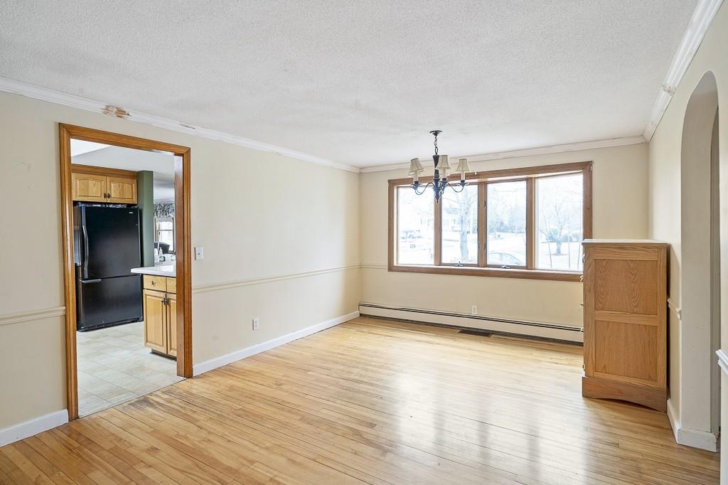 105 Sheffield Road Waltham, MA 02451 - Photo 8 of 22 wooden floor in an empty room with a window