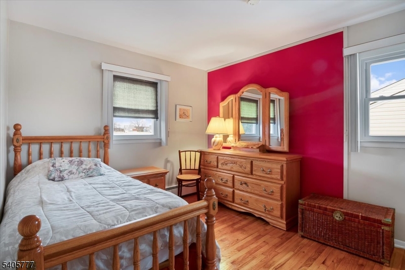 735 Garden Street Union, NJ 07083 - Photo 15 of 29 a bedroom with a bed and a dresser