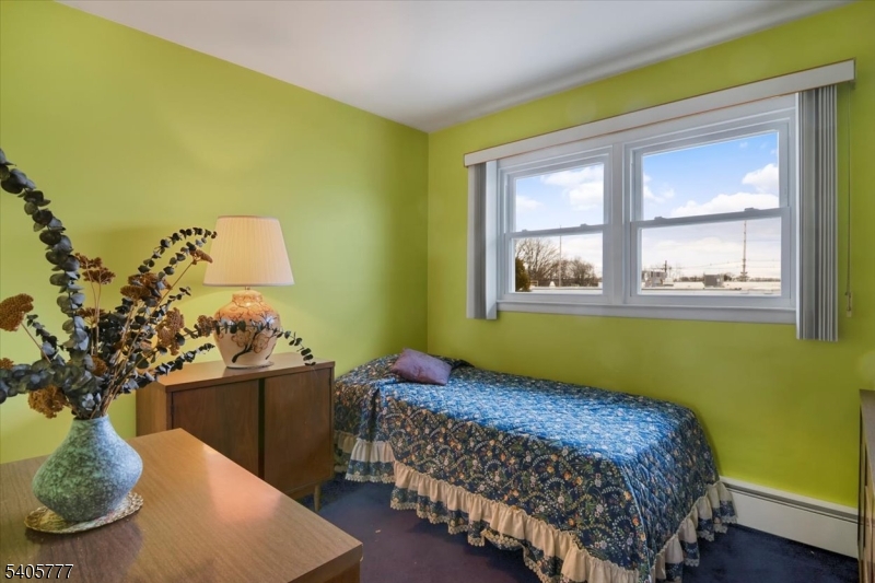 735 Garden Street Union, NJ 07083 - Photo 16 of 29 a bedroom with a bed and a window