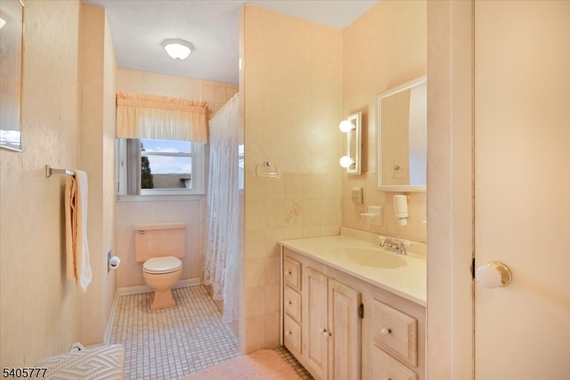 735 Garden Street Union, NJ 07083 - Photo 17 of 29 a bathroom with a sink a toilet and shower