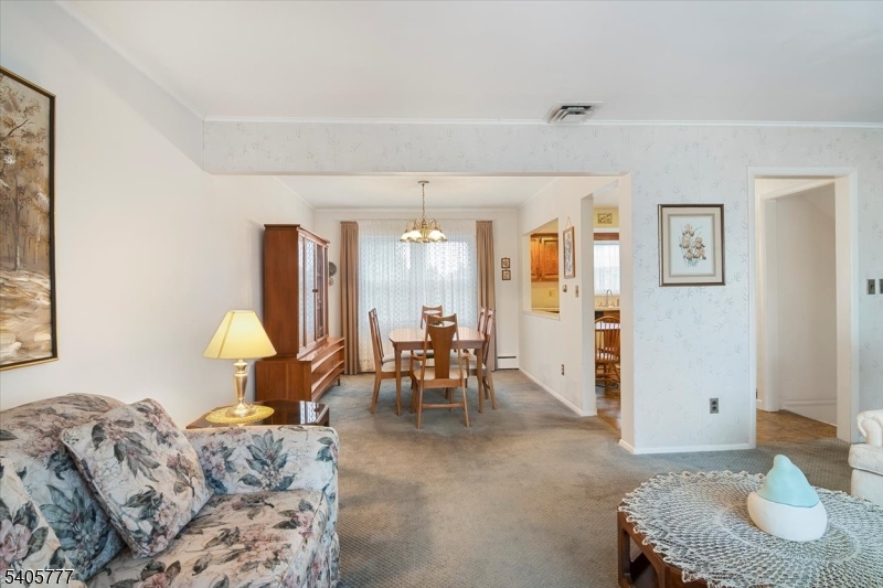735 Garden Street Union, NJ 07083 - Photo 19 of 29 a living room with furniture and a table