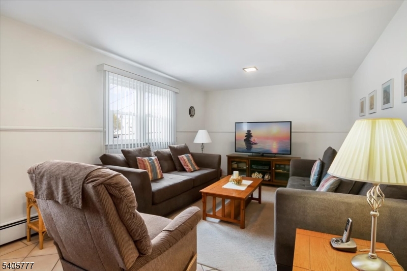 735 Garden Street Union, NJ 07083 - Photo 3 of 29 a living room with furniture and a flat screen tv