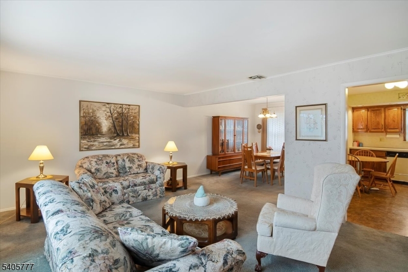 735 Garden Street Union, NJ 07083 - Photo 7 of 29 a living room with furniture and a wooden floor