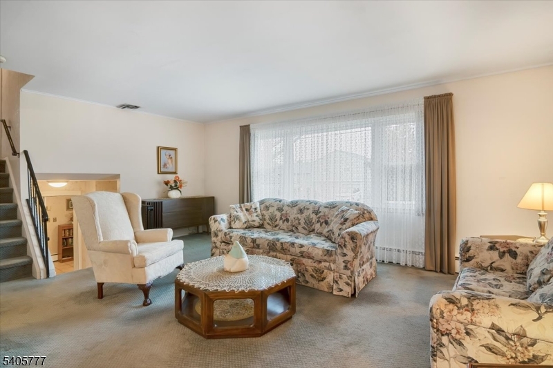 735 Garden Street Union, NJ 07083 - Photo 9 of 29 a living room with furniture and a window