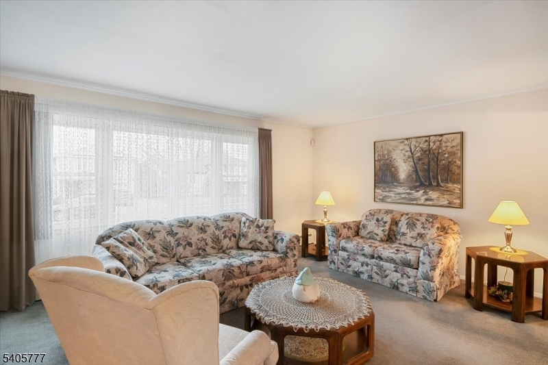 735 Garden Street Union, NJ 07083 - Photo 10 of 29 a living room with furniture and a couch
