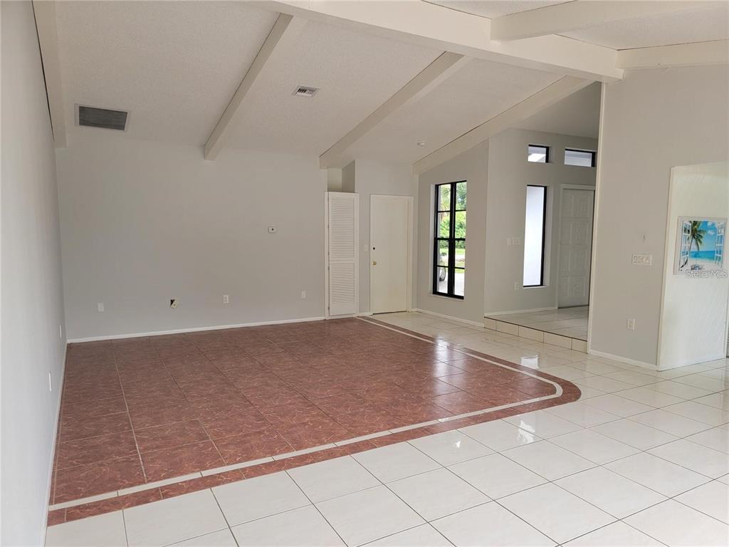 26221 Constantine Road Punta Gorda, FL 33983 - Photo 4 of 27 a view of a livingroom with wooden floor